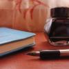 Libreta luma y frasco de tínta