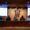 Expositor frente asistentes en auditorio