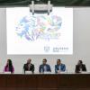 Autoridades del evento en presidium frente a asistentes