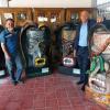 Autoridades del evento junto a las máscara de tastoán