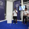 Alumnos en estand en Campus Party en México