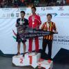 Atletas en podium de premiación