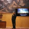 Expositor frente asistentes en auditorio