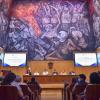 Representantes de colectivos frente a asistentes en auditorio