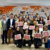Autoridades del evento junto a artista y alumnas del plantel que colaboraron en mural