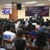 Asistentes a conferencia en auditorio